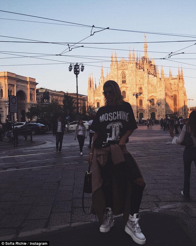Tourists! Getting in a little sightseeing on Sunday, Richie shared a snap of herself striking an edgy pose in front of the Milan Cathedral while clad in a Moschino top and a beige sweater wrapped around her waist