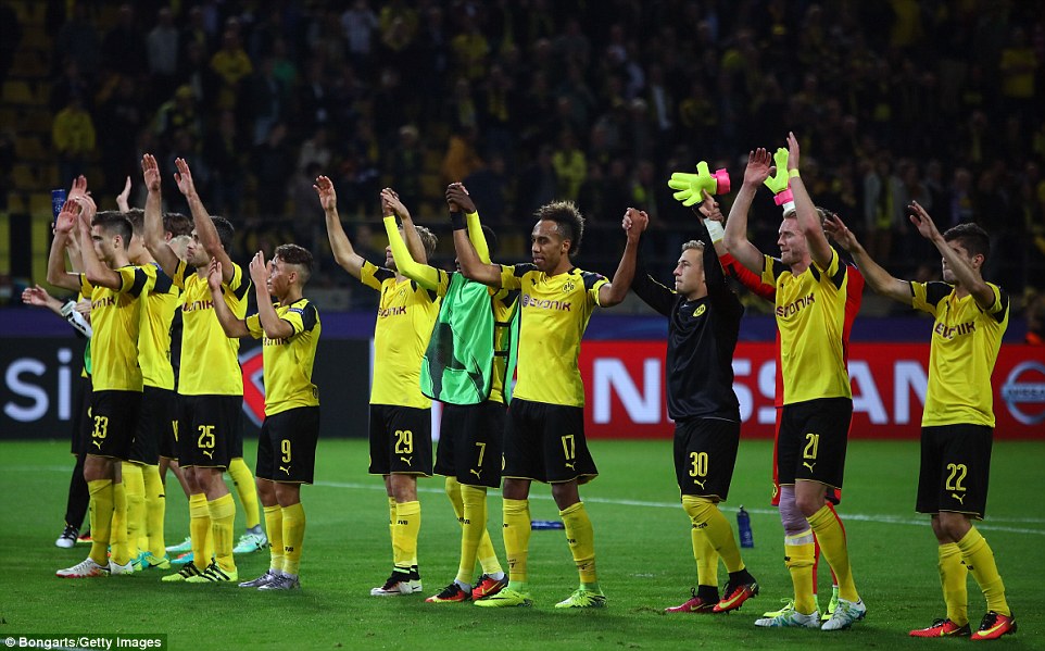 The Dortmund squad salute their home support after their secured a late draw on their home turfÂ 