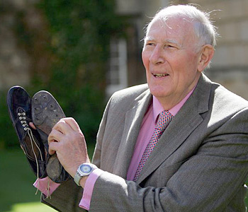 Sir Roger Bannister with running shoesSir Roger Bannister holds the running shoes that he wore 50 years ago when he ran the four-minute mile on May 6, 1954, while studying medicine at Oxford